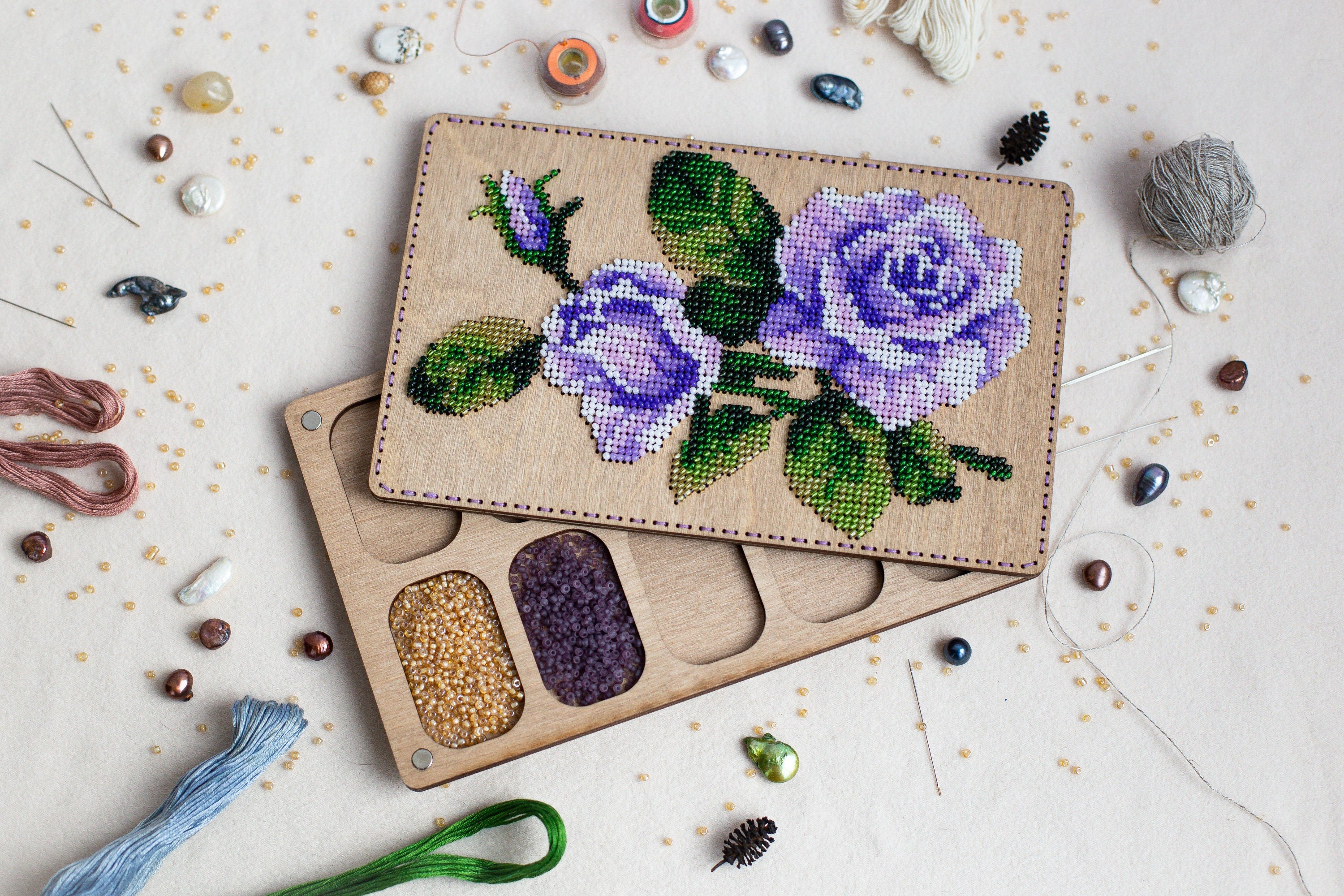 a couple of wooden trays with flowers on them